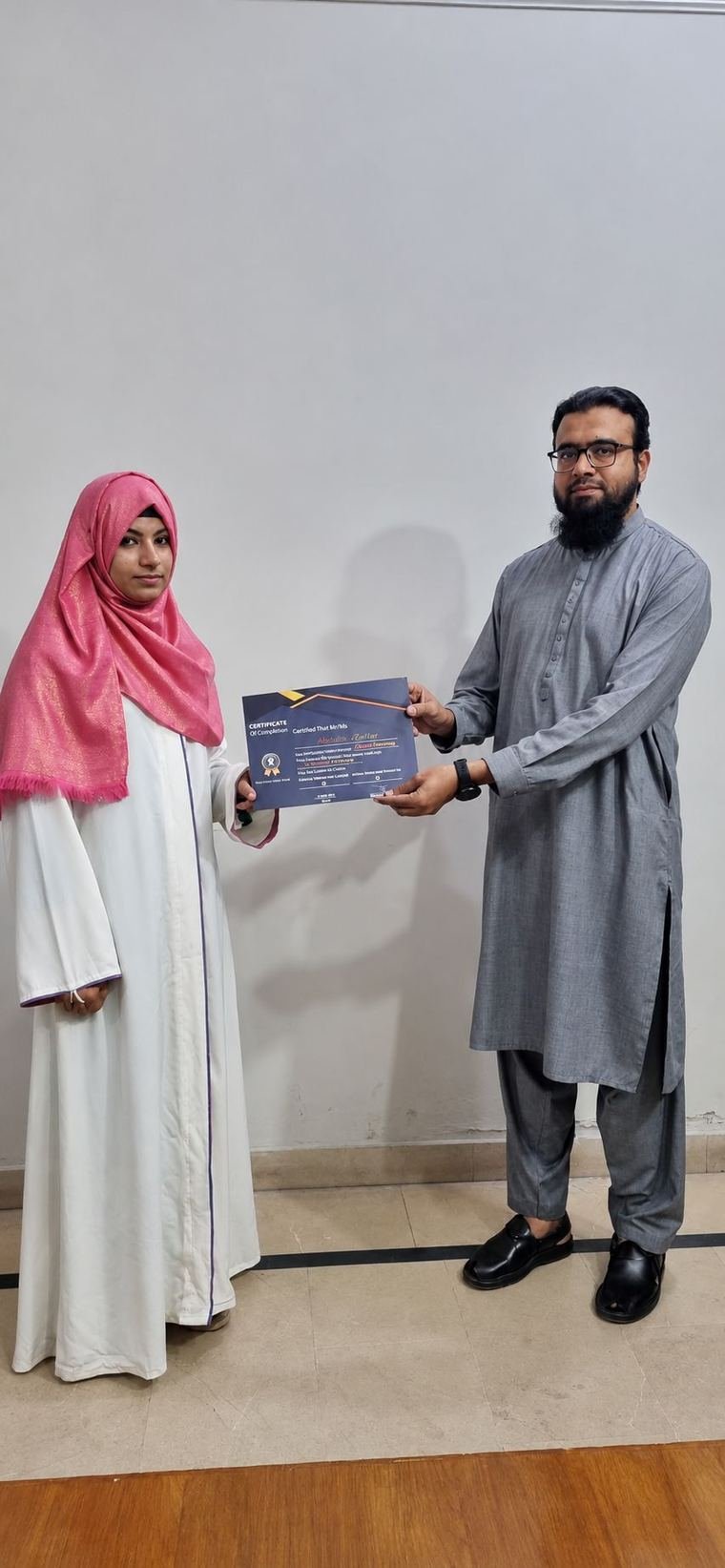 InnoTech graduate receiving a certificate at the Jubilee Town campus