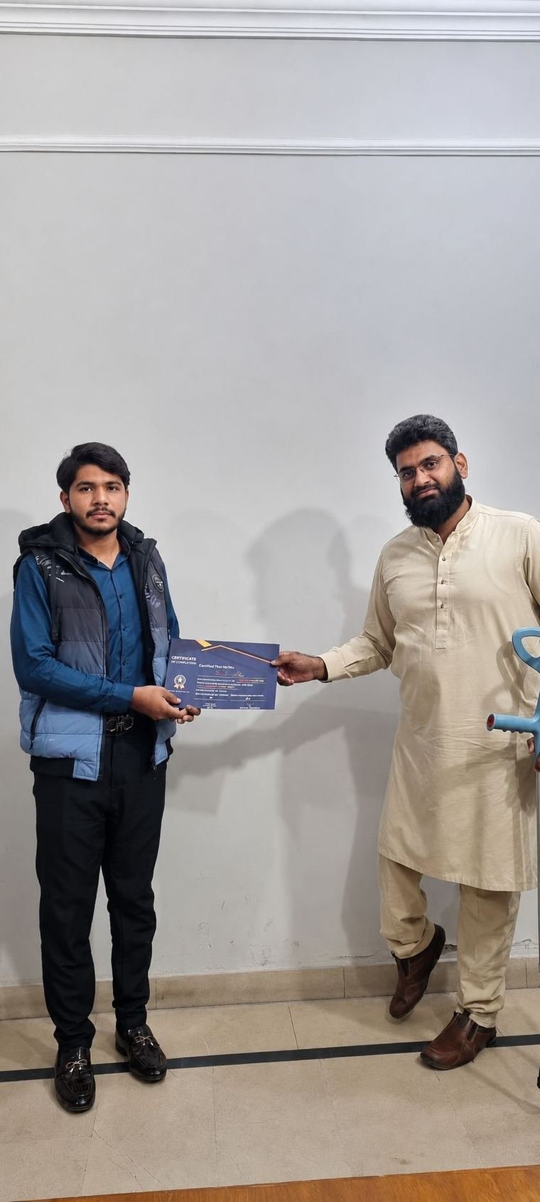 InnoTech graduate receiving a certificate at the Jubilee Town campus