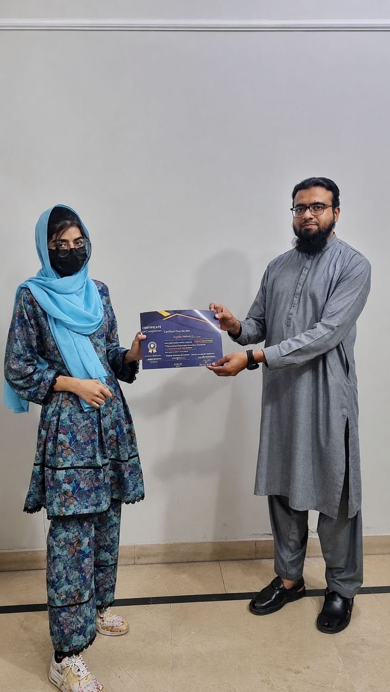 InnoTech graduate receiving a certificate at the Jubilee Town campus
